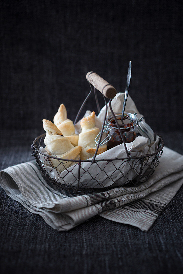 Vegan puff pastries filled with a sugar-free chocolate spread in a wire basket