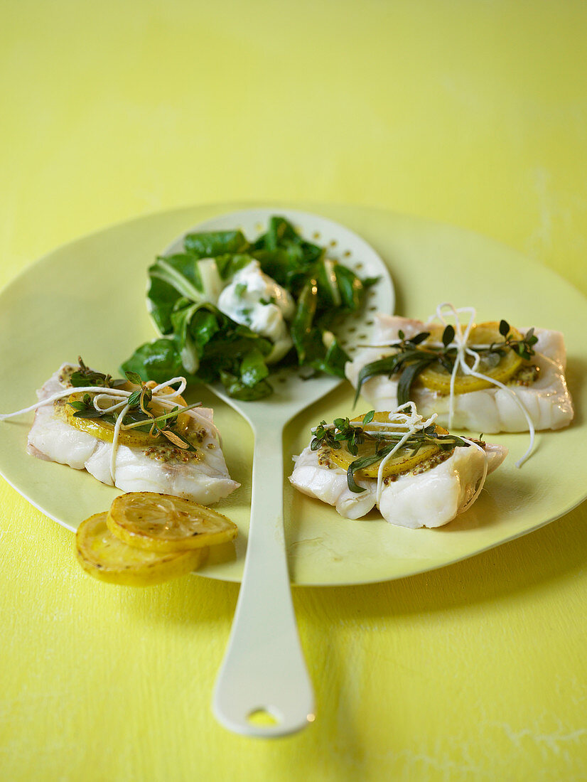 Lemon fish parcels with herbs and chard