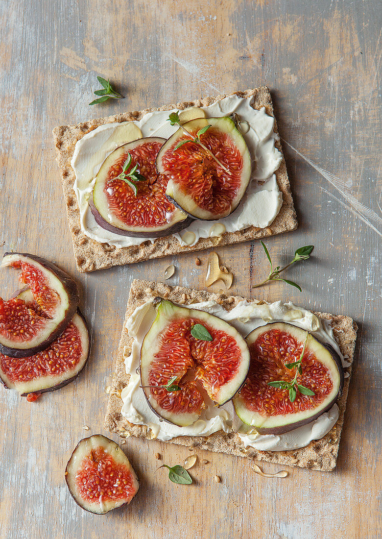 Crisp bread topped with cream cheese, figs, honey and thyme