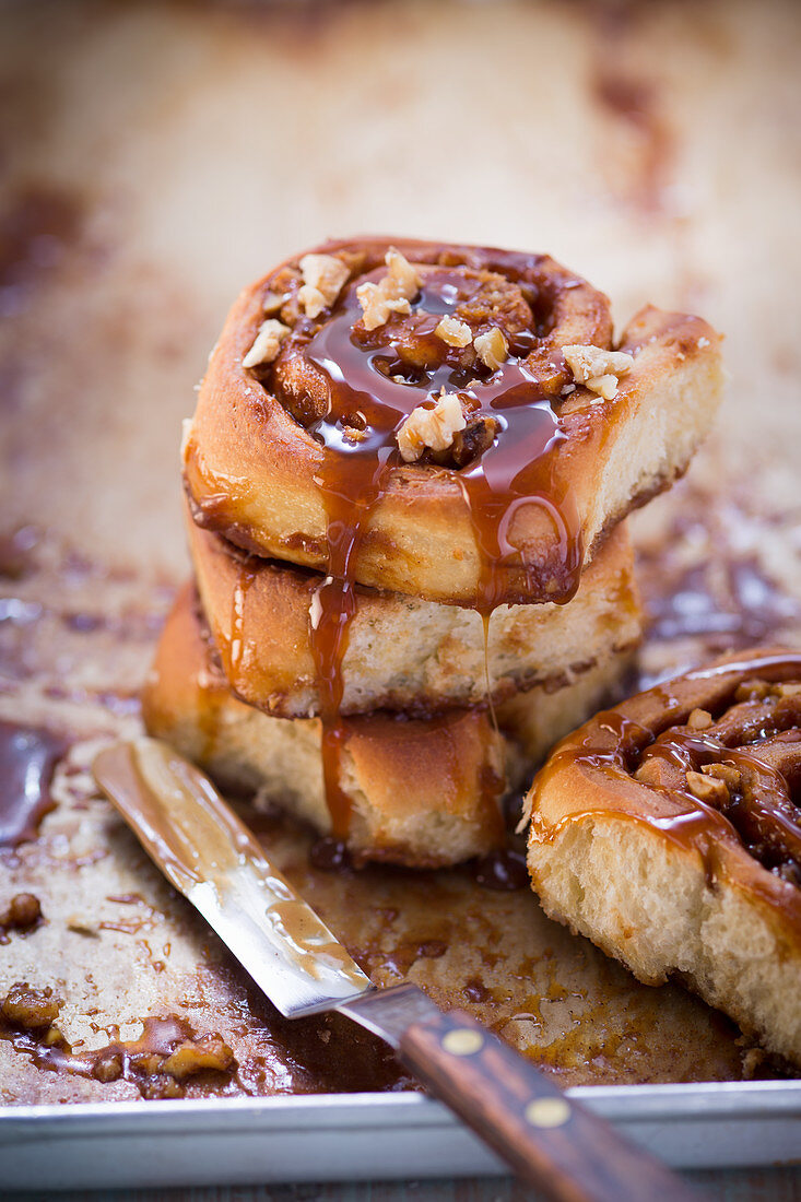 Cinnamon rolls with chopped nuts and caramel sauce