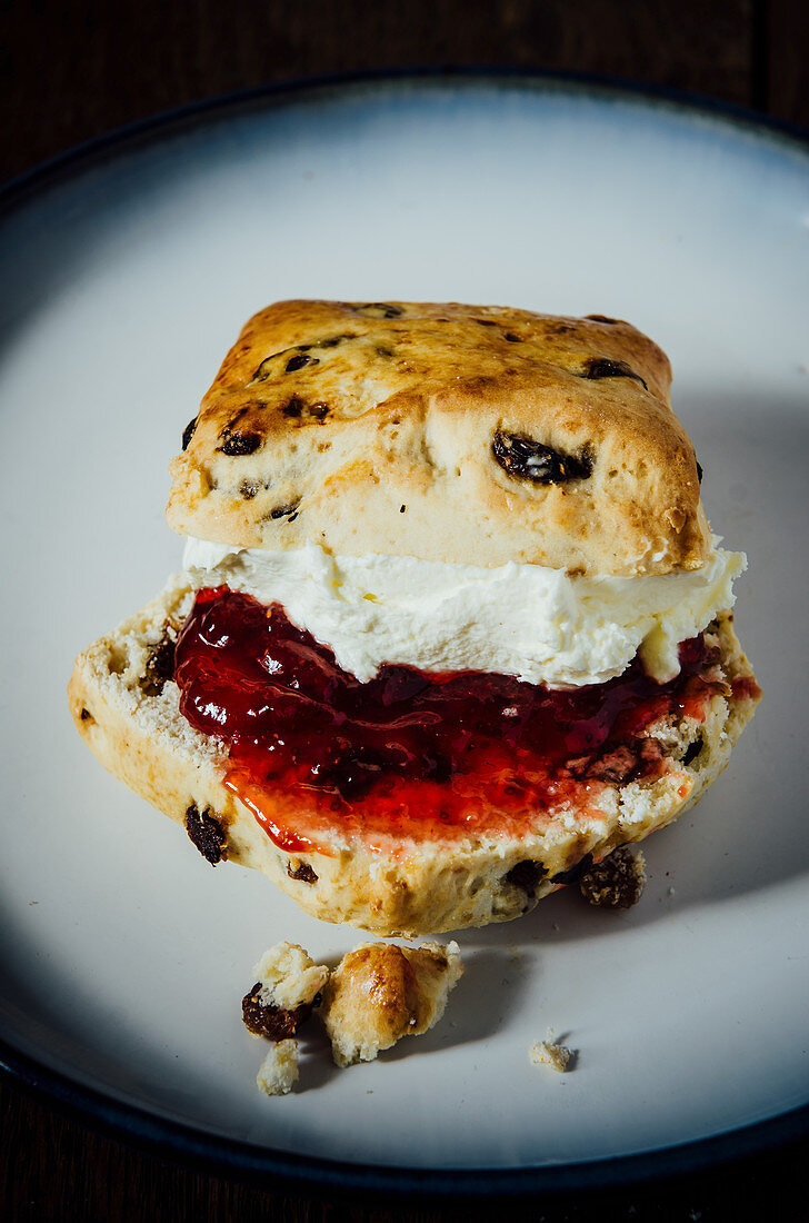 A scone with jam and clotted cream (England)