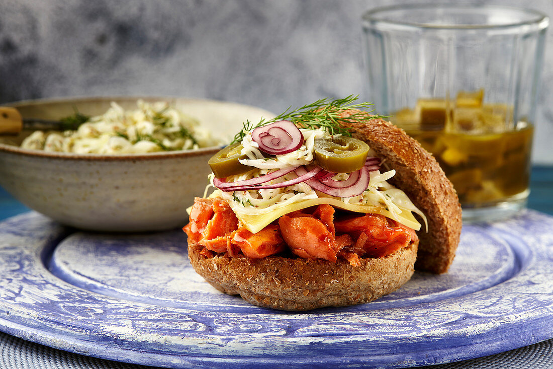 A pulled salmon burger with honey