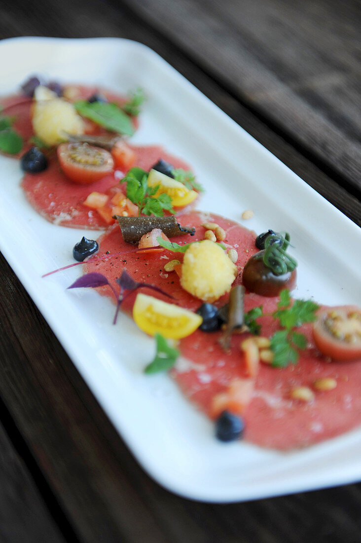 Tomato carpaccio on a platter