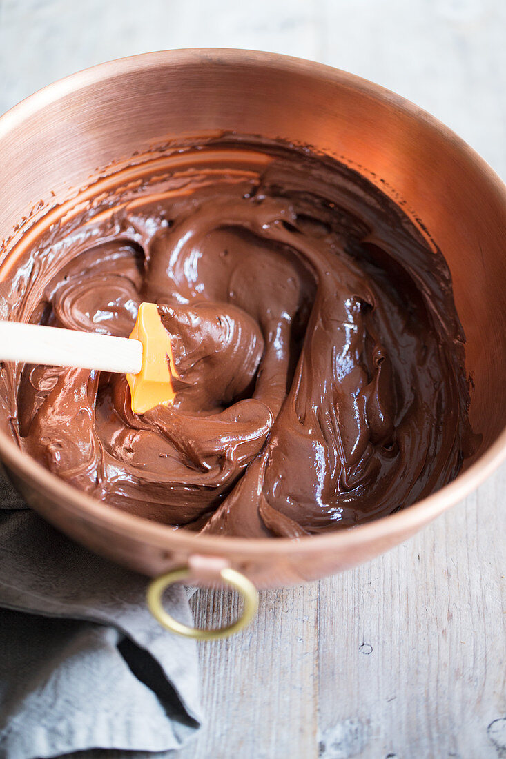 Chocolate cream in a copper mixing bowl