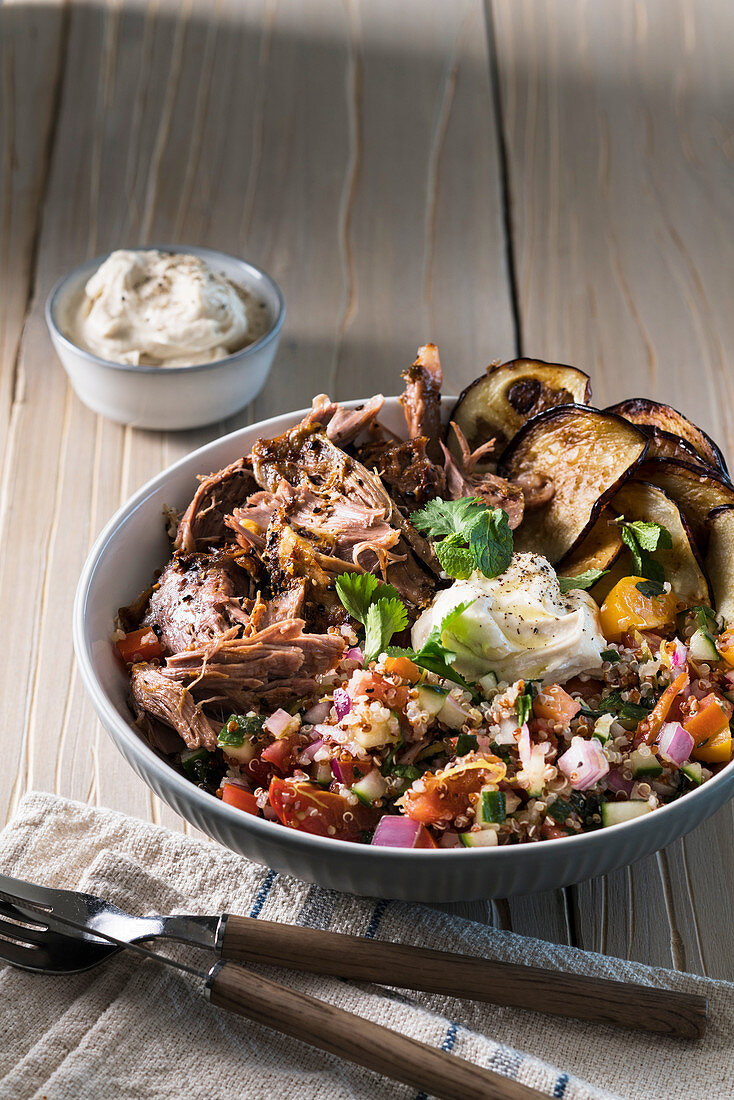 Slow cooked pulled lamb with a quinoa and tomato salad