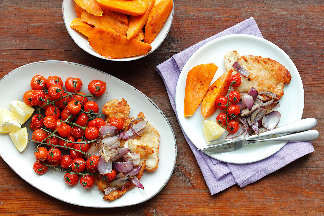 Turkey schnitzel, sweet potatoes and baked tomatoes