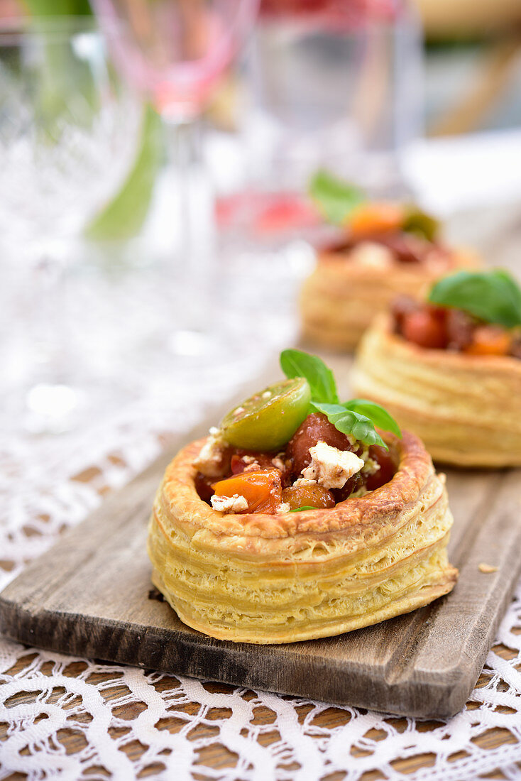 Puff pastry tarts with tomatoes and feta