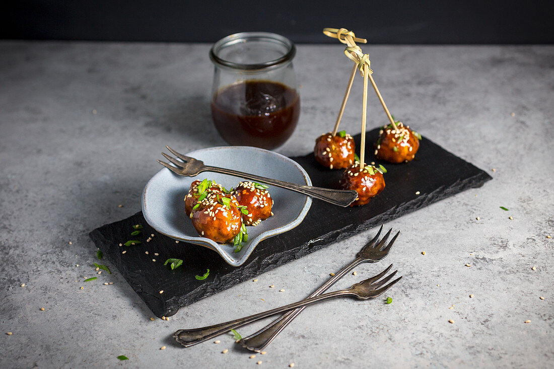 Meatballs with a Hoisin glaze and sesame seeds