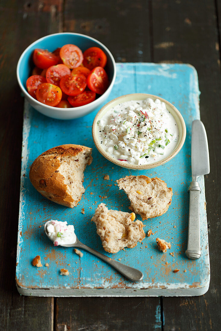 Roll, cottage cheese with red radishes and scallion, cherry tomatoes