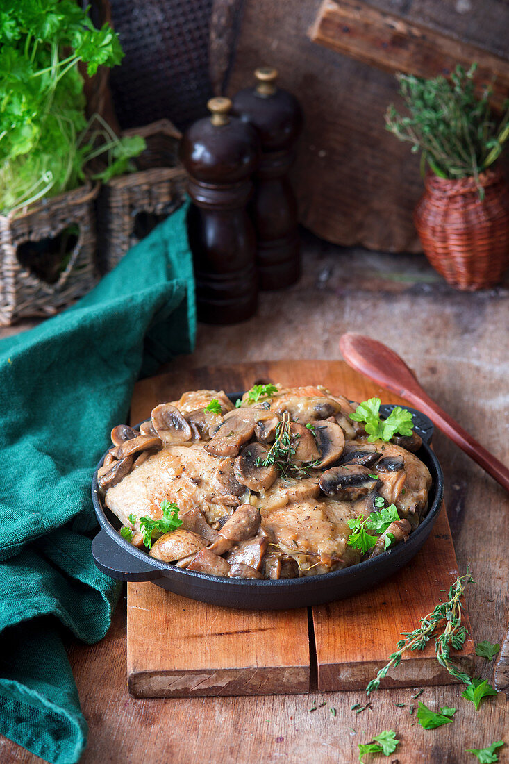 Chicken in a creamy sauce with mushrooms and herbs