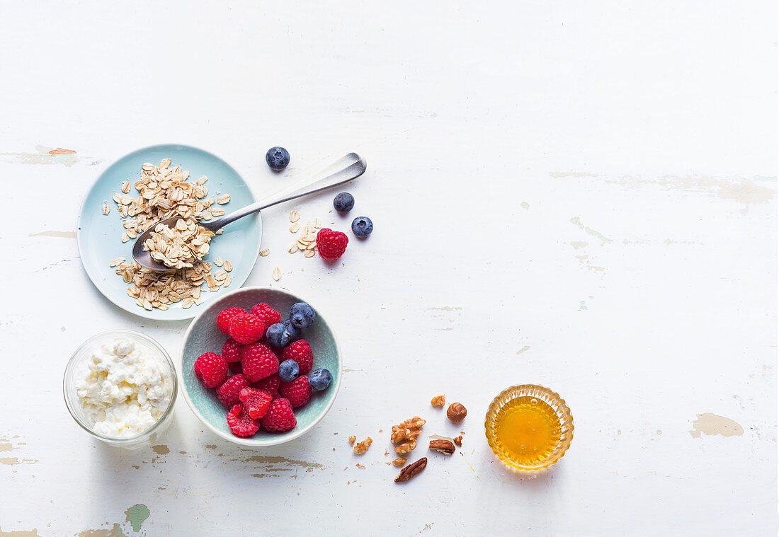 Healthy breakfast - berries, oatmeal, granola cream cheese