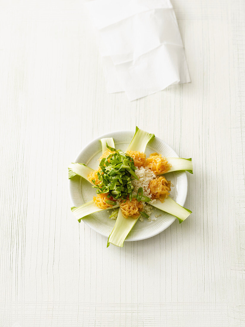 Bok choy spoons with couscous and curry sauerkraut