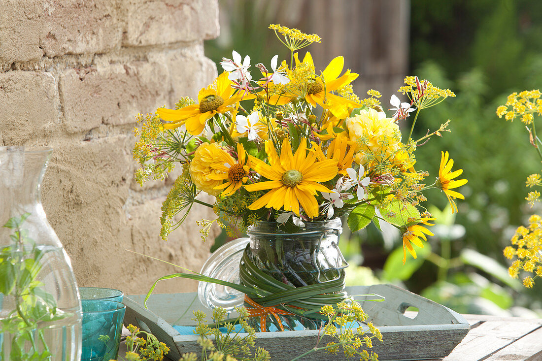 Rural bouquet of yellow and white flowers