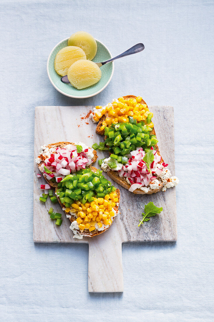 Healthy colourful vegetable cubes on bread, and Harzer cheese