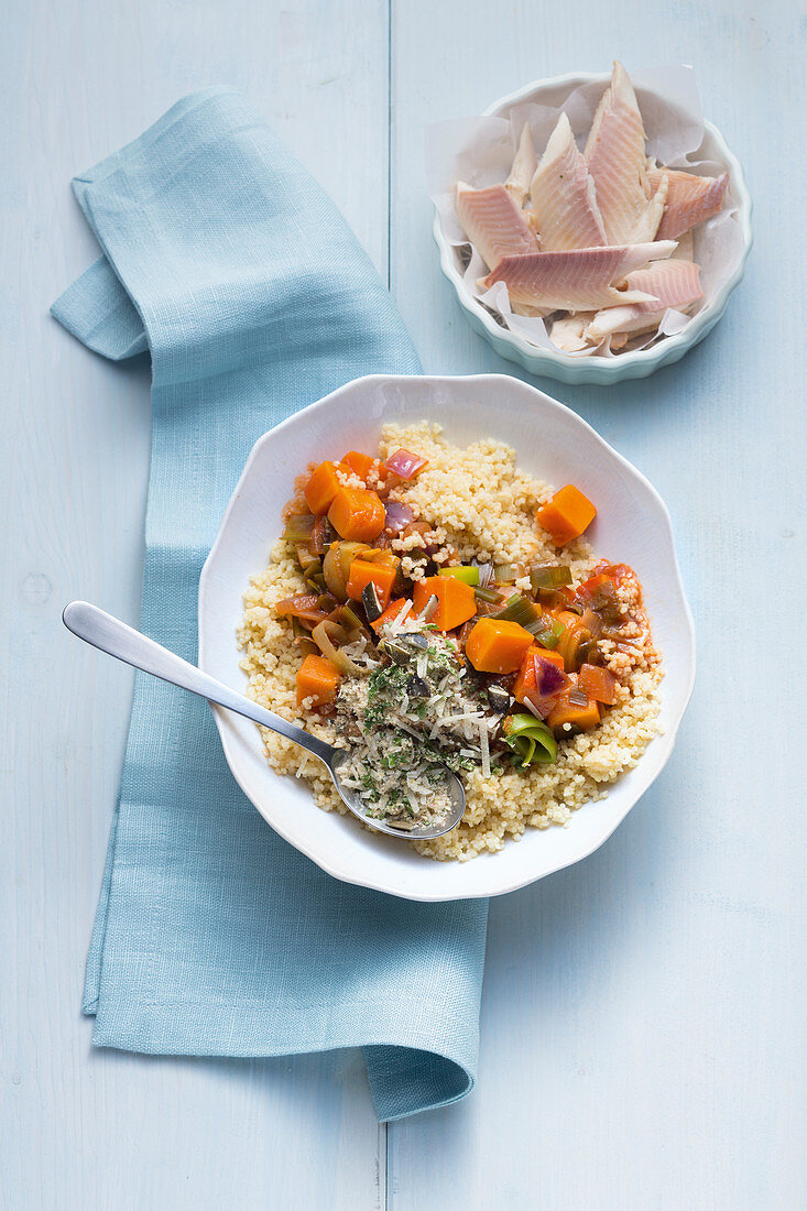 Vegetable goulash with millet, topped with pumpkin seeds and parmesan
