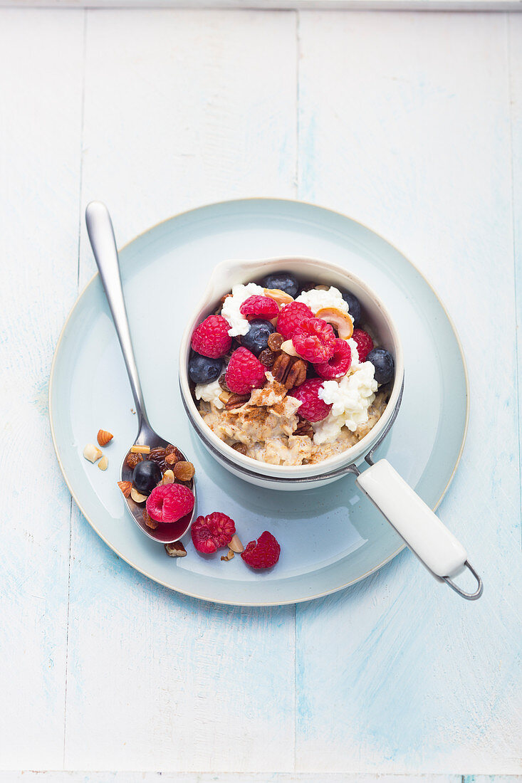 Warm oatmeal with pecans and fresh berries