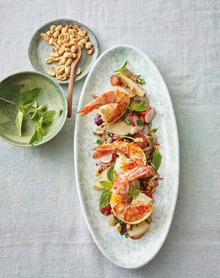 Fried prawns on sweet and sour pomelo and radish salad