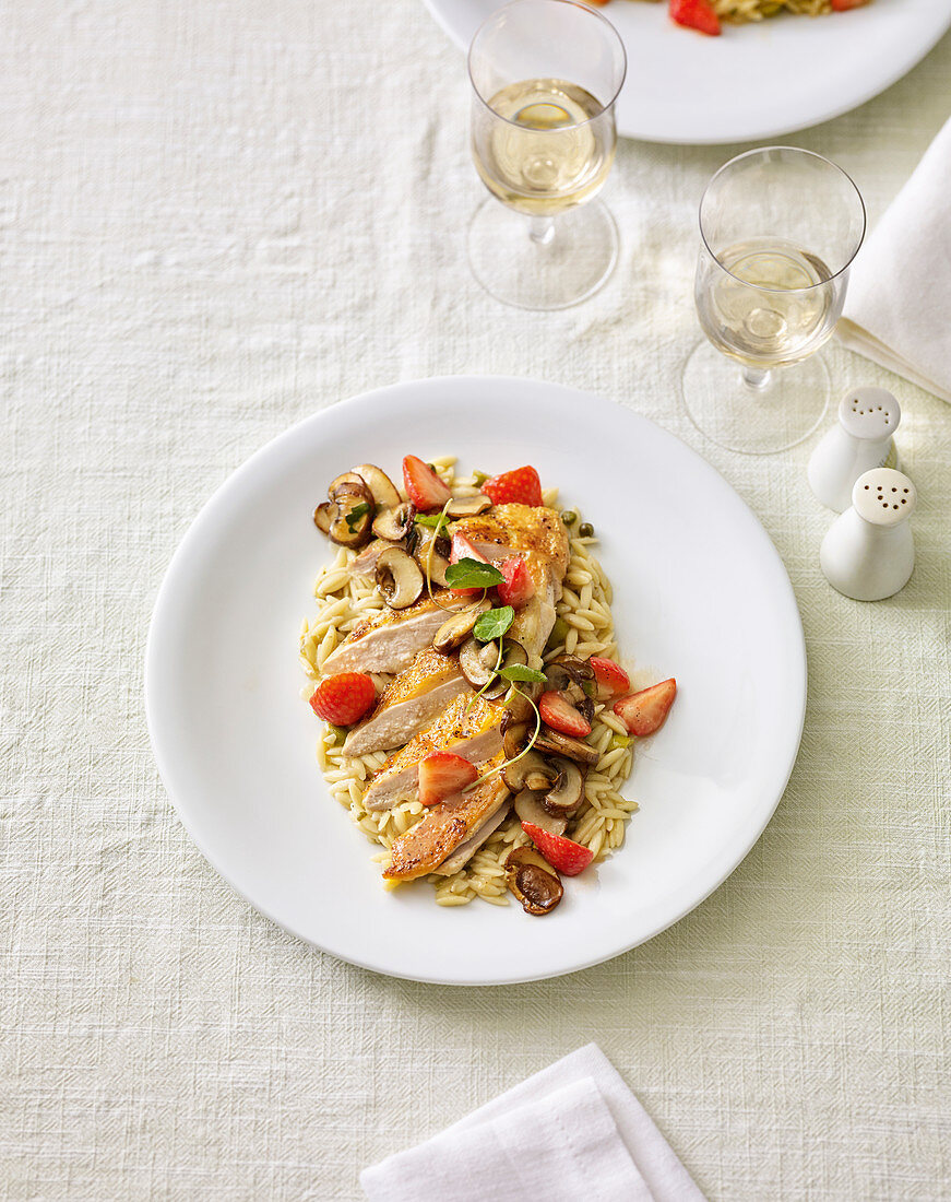 Guinea fowl breast with strawberries, capers and orzo pasta