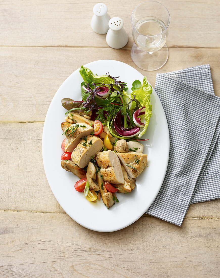 Roasted corn-fed chicken on a mushroom salad