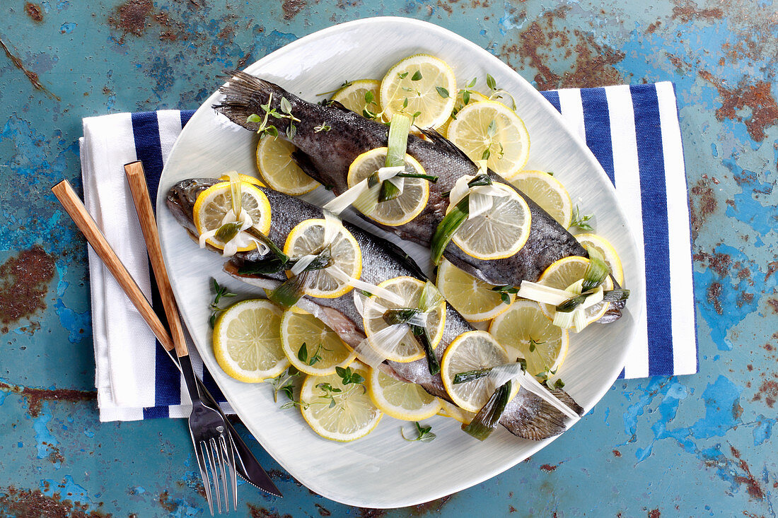 Two trout with lemon slices