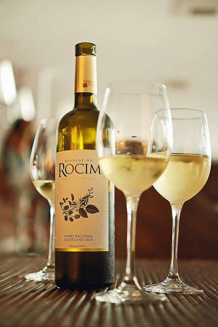 White wine in a bottle and in glasses, Herdade do Rocim winery, Alentejo, Portugal