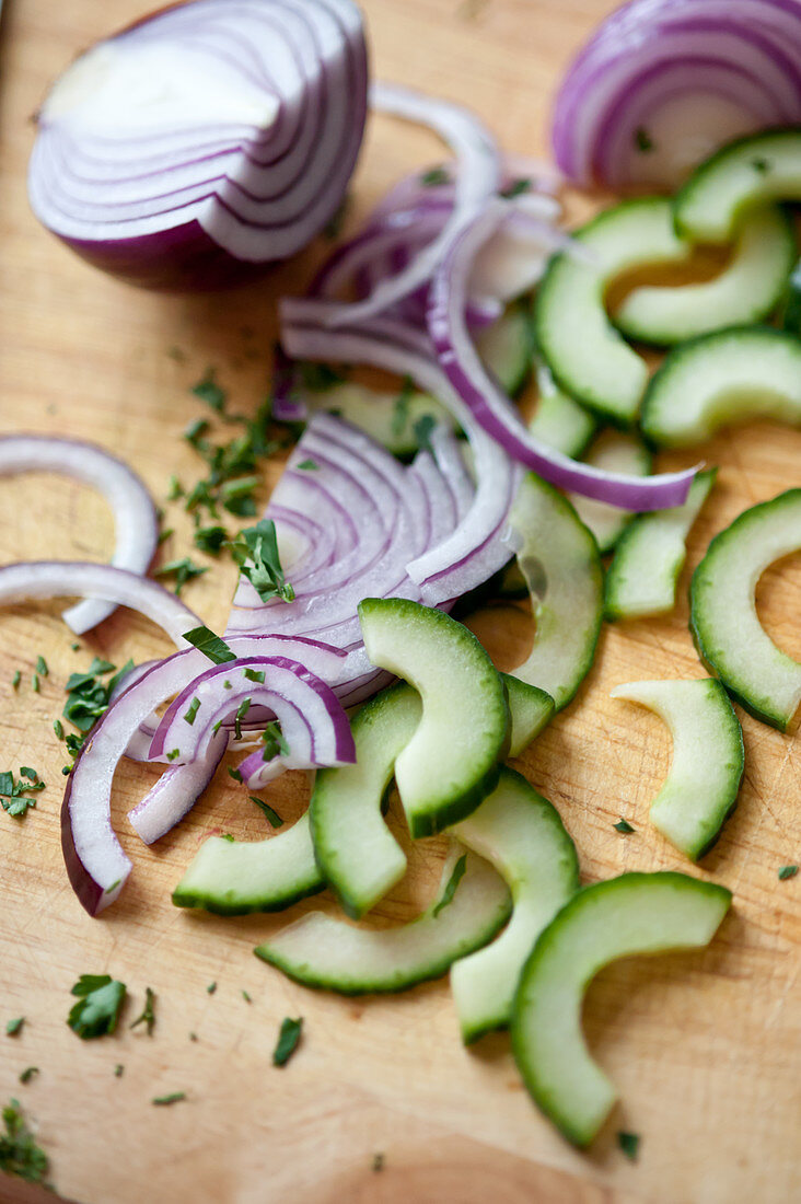 Sliced red onion and cucumbers