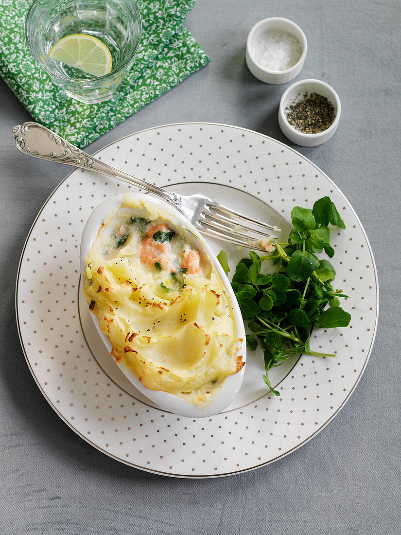 Salmon pie with mashed potatoes, shrimp and watercress