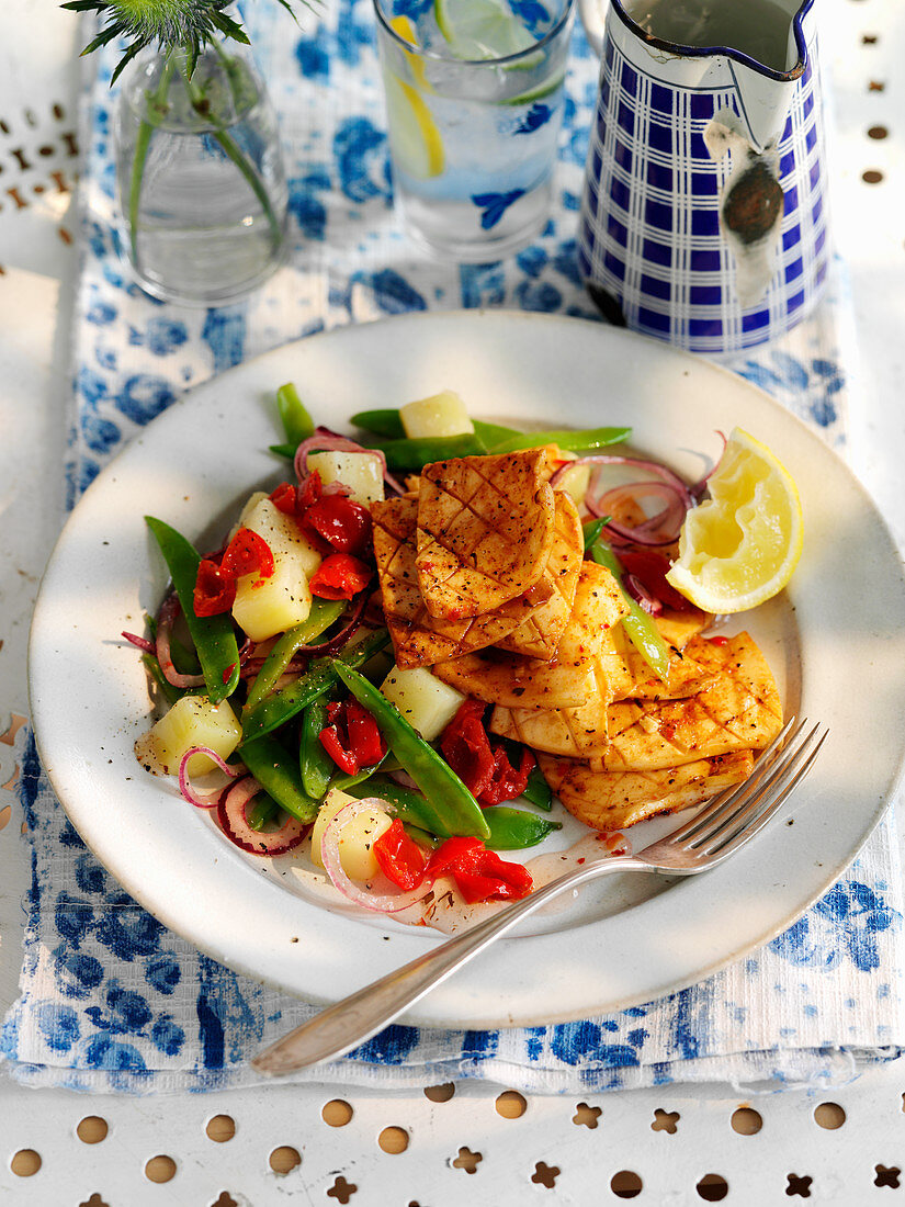 A vegetable salad with piri piri grilled octopus