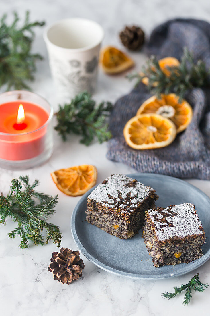 Poppy seed cake with orange zest, dusted with icing sugar