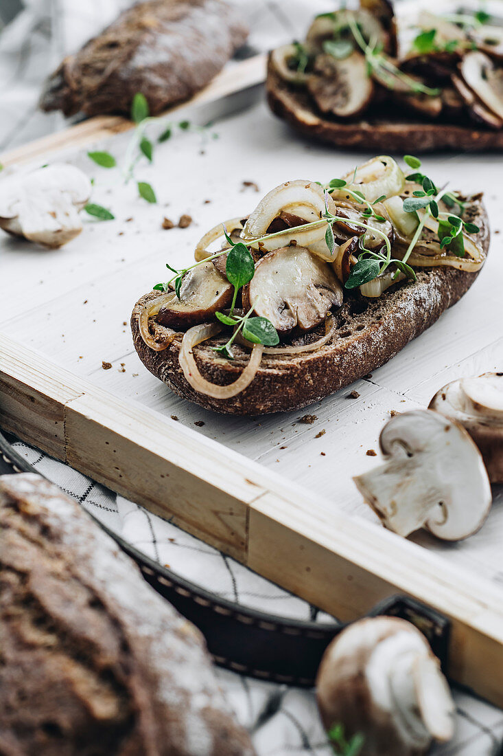 Sandwiches with chamigno mushrooms and onion, decorated with fresh thyme