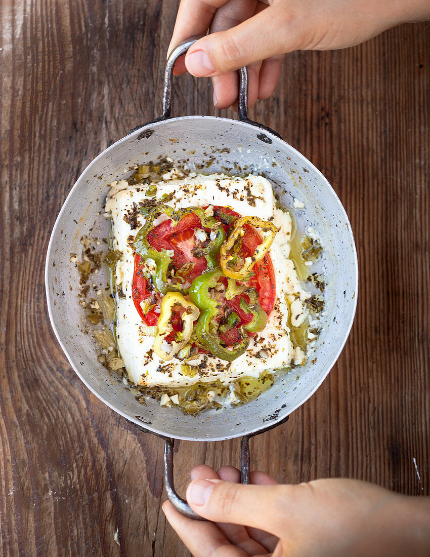 Feta cheese with peppers, herbs and olive oil