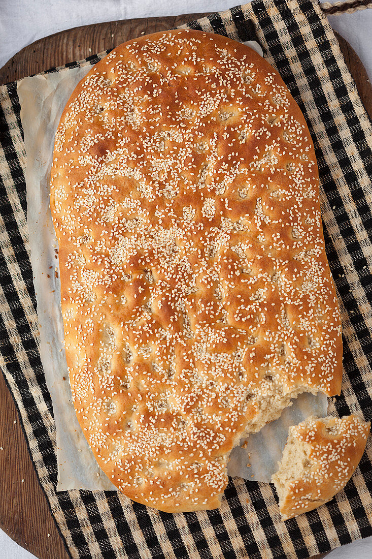 Unleavened bread with sesame seeds, broken