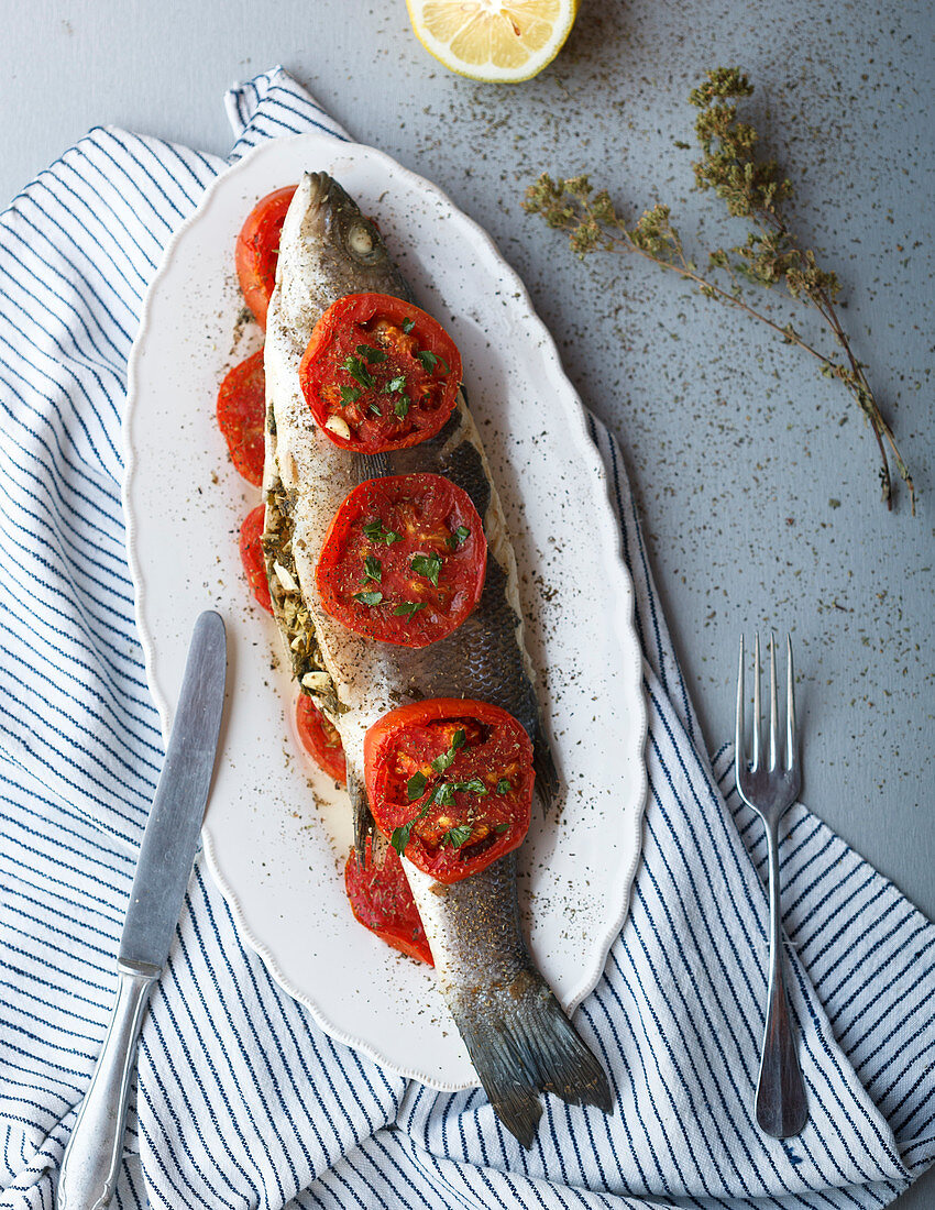 Stuffed fish with herbs and tomatoes