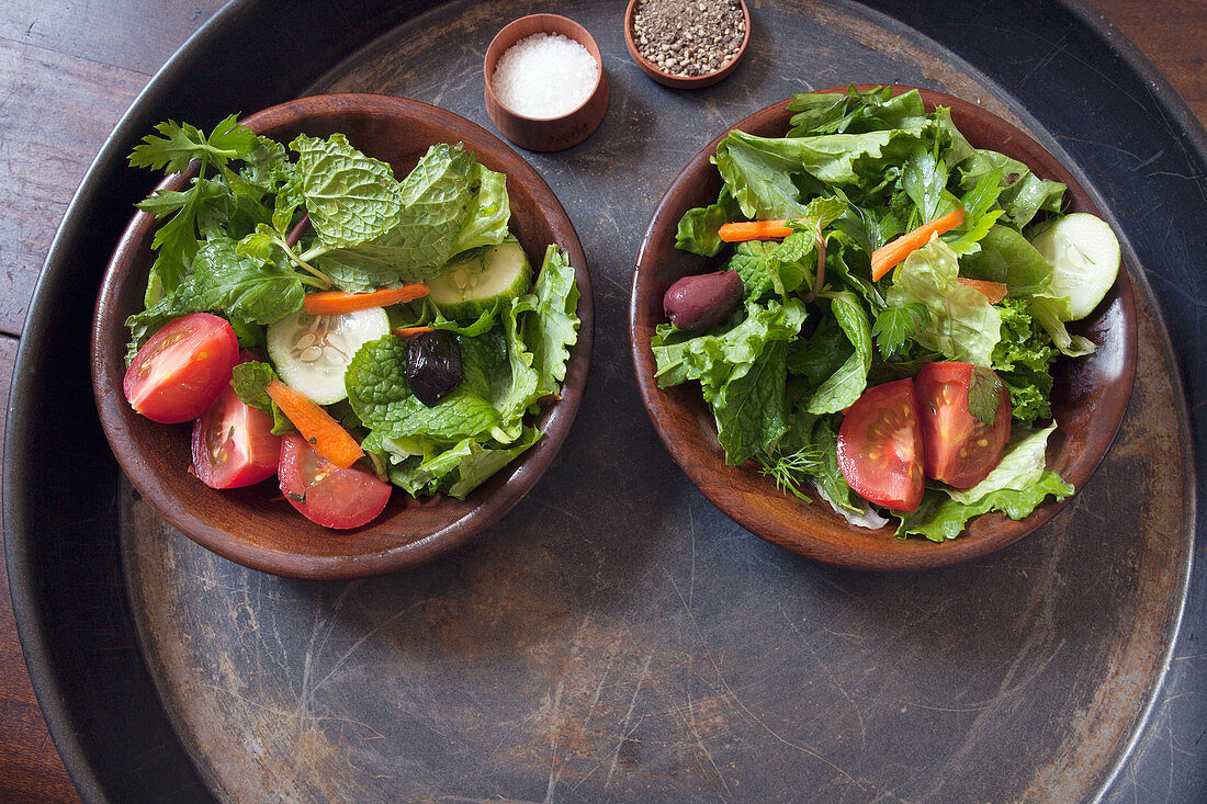 Dressed Leafy Green Salad in Wooden Bowls