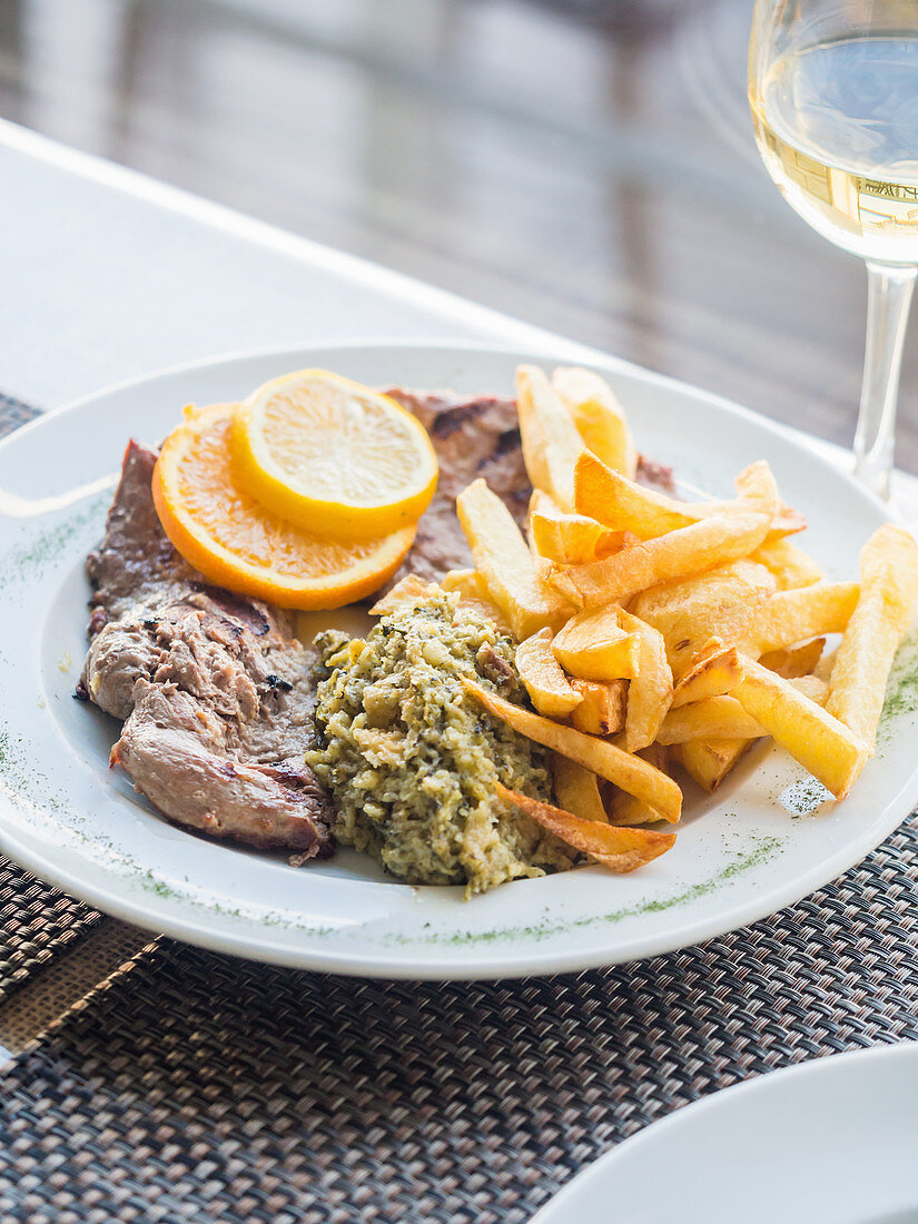 Fillet of Iberico pork with spinach migas and chips (Portugal)