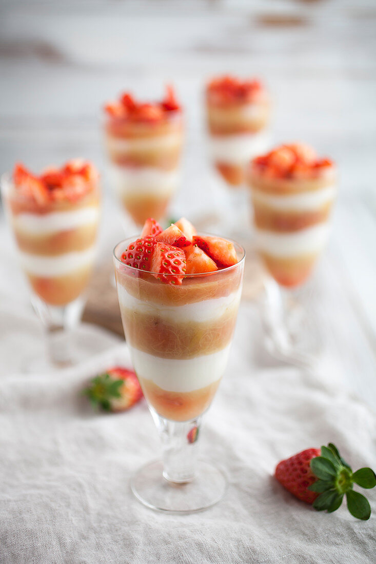 Creamy layered desserts with strawberries and rhubarb