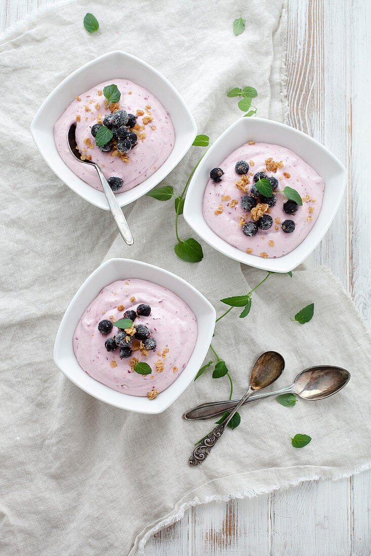 Creamy desserts made with blackcurrants, cottage cheese and vanilla