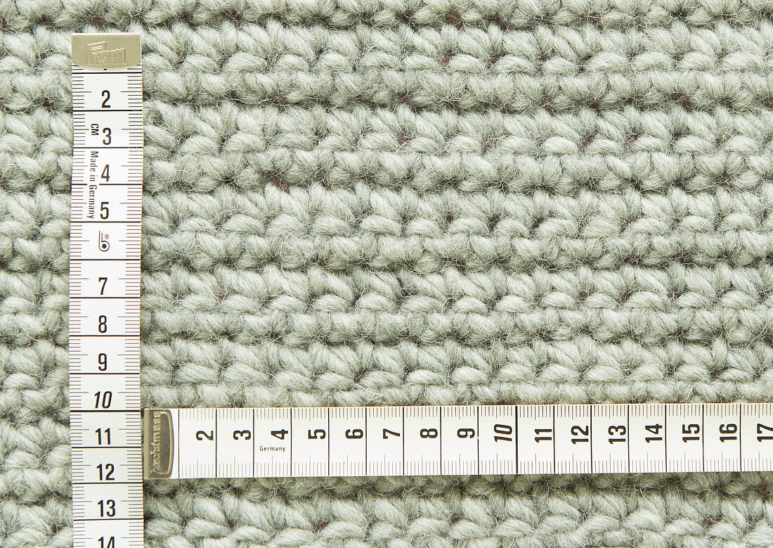 A counting frame on a piece of crochet