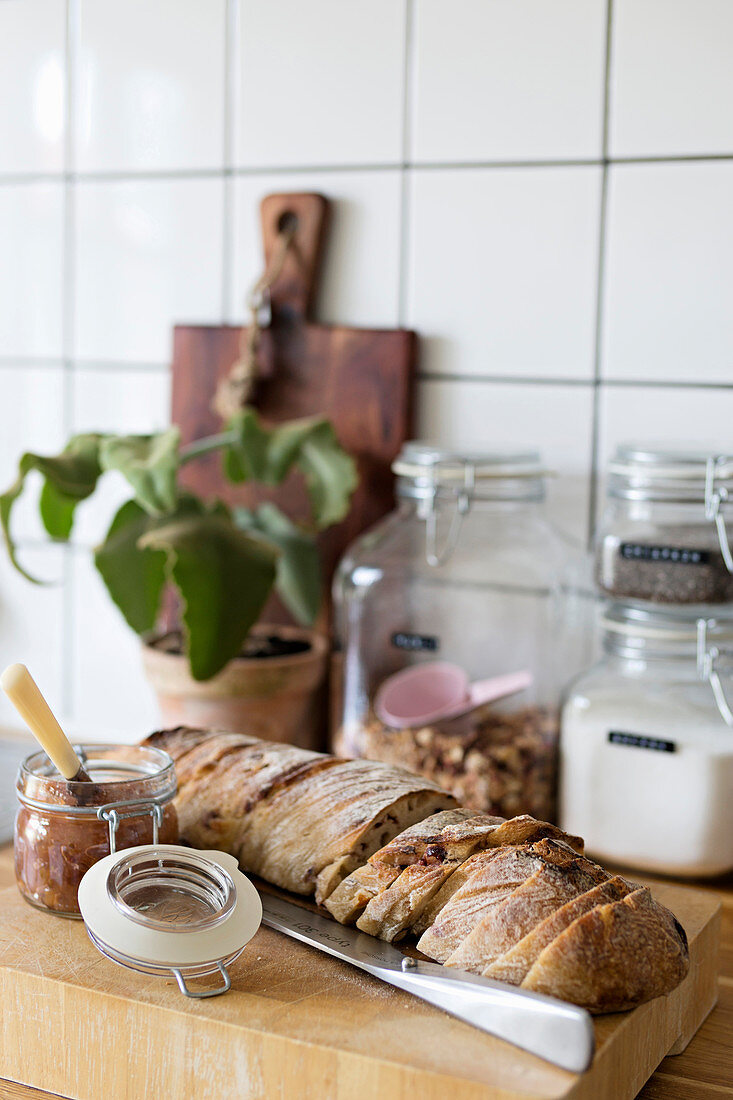 Sliced bread on chopping board in kitchen