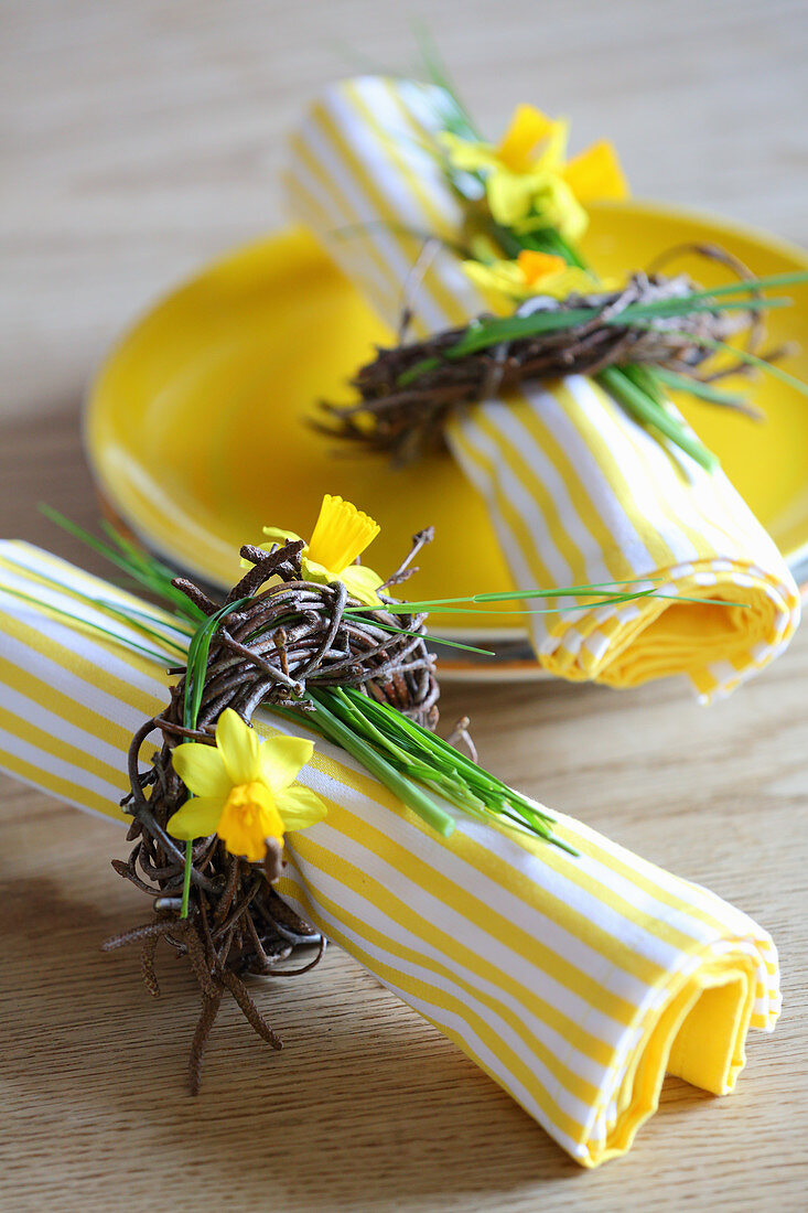 Yellow and white striped napkins with Easter wreaths and yellow plate