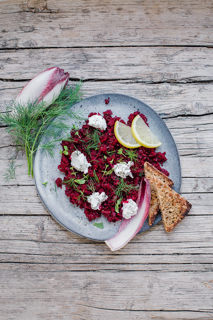 Beetroot tartare with purple chicory, dill, cream cheese and grilled bread
