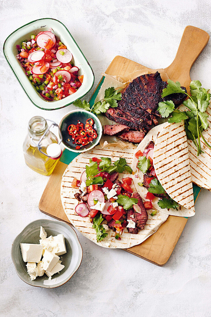 Charred beef tacos with tomato radish salsa