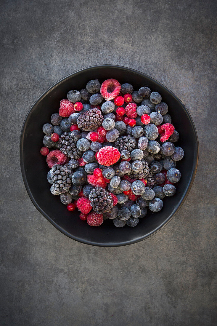 A bowl of frozen fruits of the forest