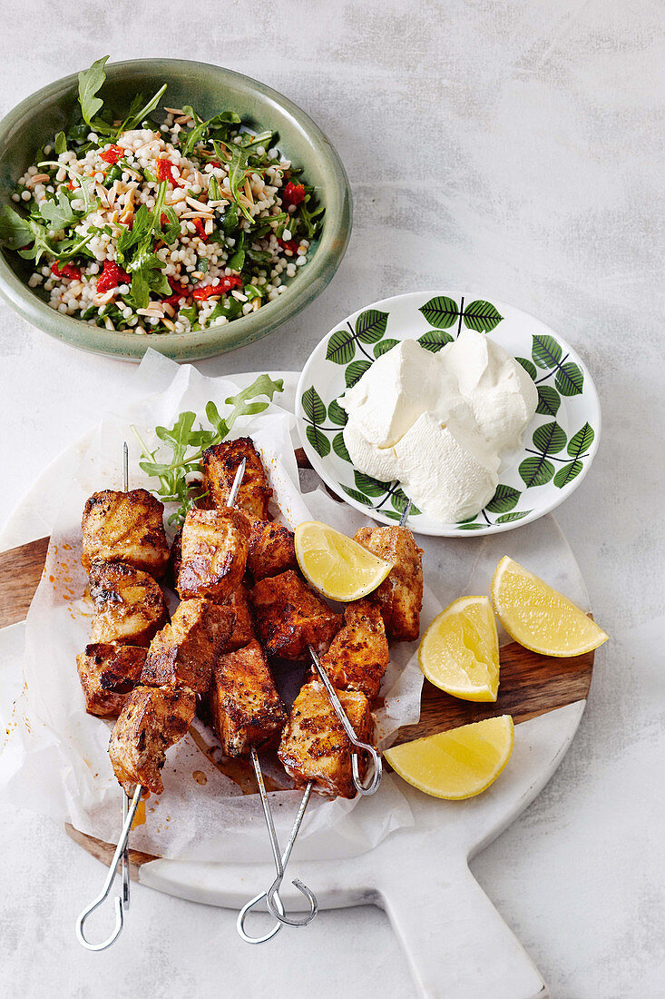 Spiced fish kebabs with pearl couscous salad