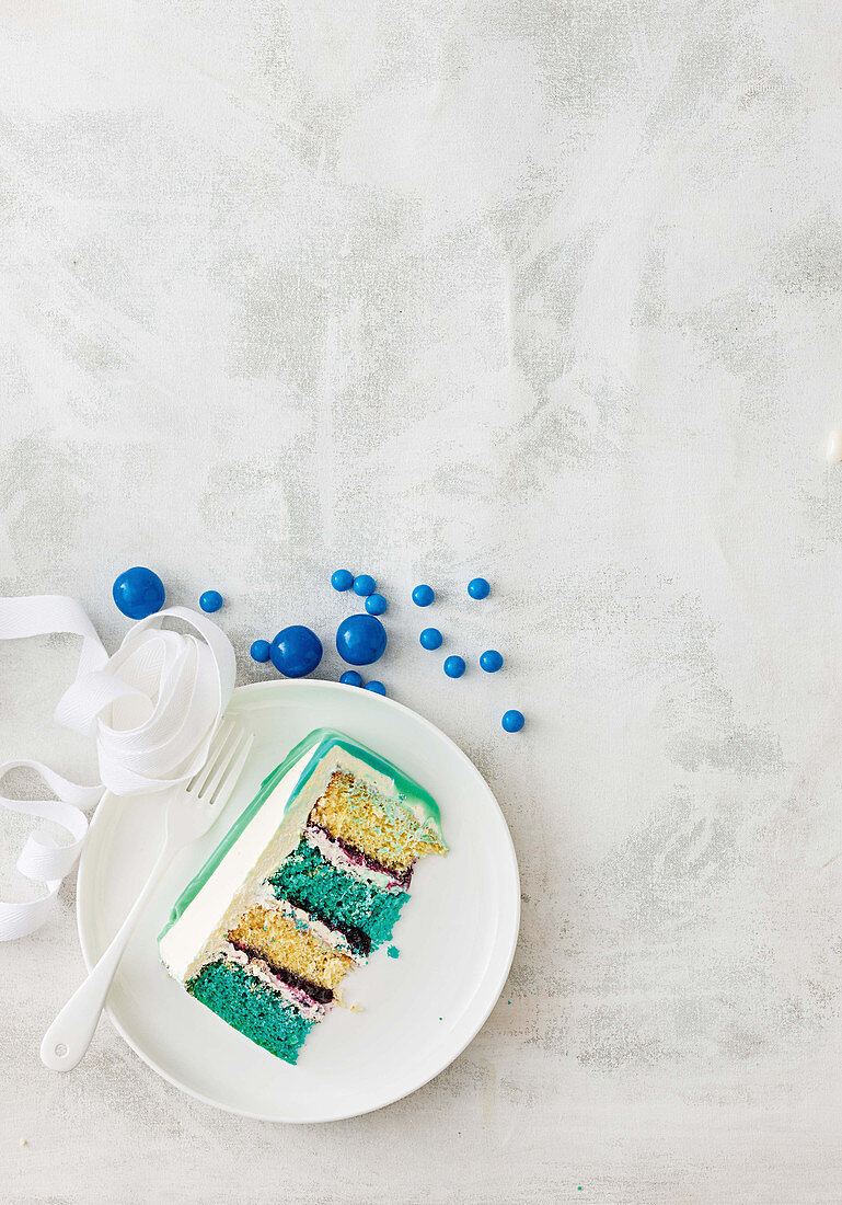 Blue layered sponge with ganache drizzle