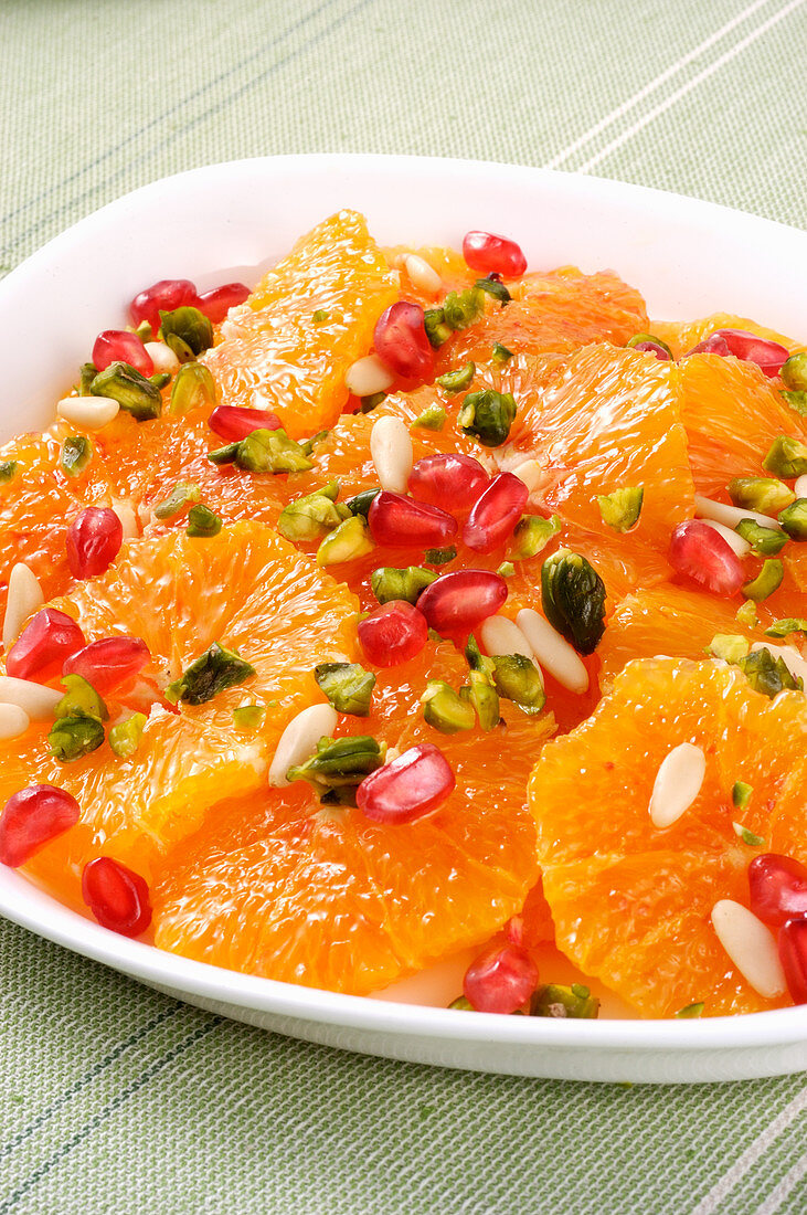 Oranges with pistachios, pine nuts and pomegranate seeds