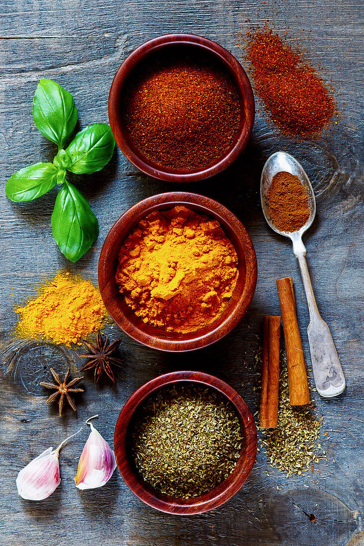 Mixed Spices and Herbs over dark old wood. Food and cuisine ingredients