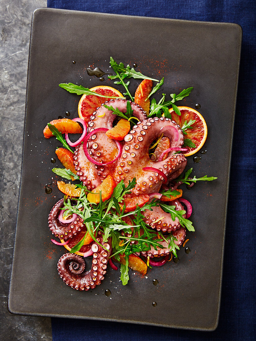 Octopus salad with blood oranges, arugula and red onions