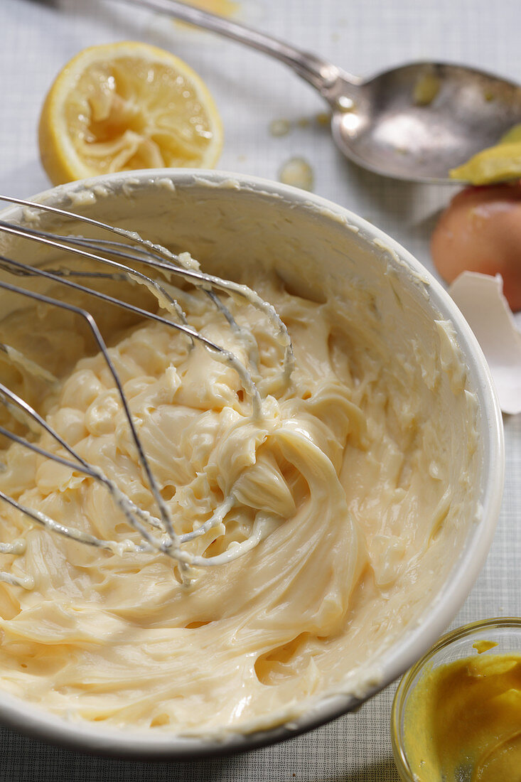 Mayonnaise being stirred in a bowl