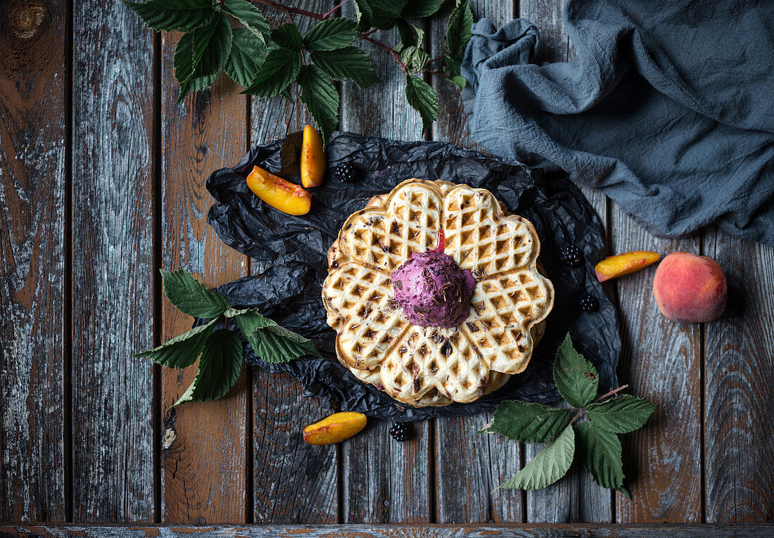 Vegan stracciatella waffle with blackberry and peach ice cream